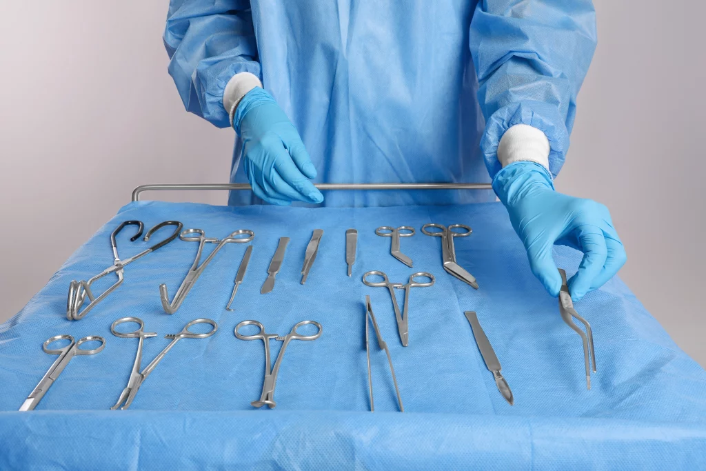 organized surgical tools being layed out on cart